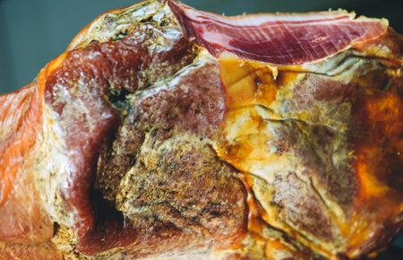 Dry-cured spanish ham Jamon. Close-up view.