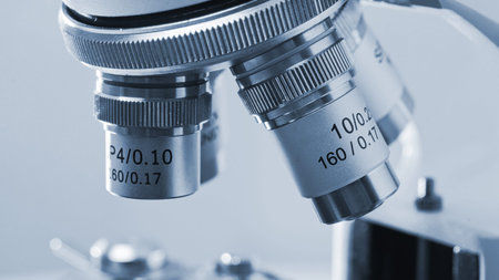 Close-up view of magnification mechanism of microscope lens.