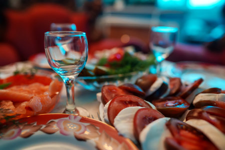 Festive table. Vodka glasses and snacks.の写真素材