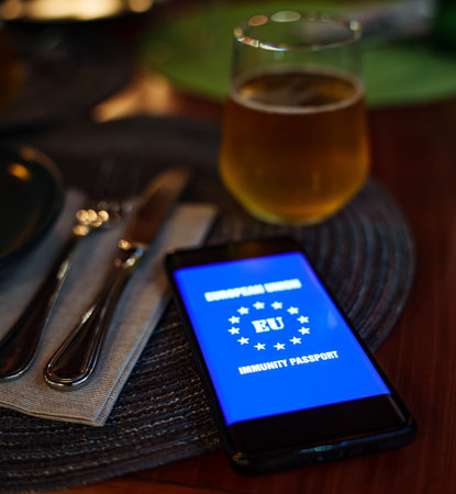 Smartphone app with certificate of immunization in restaurant.