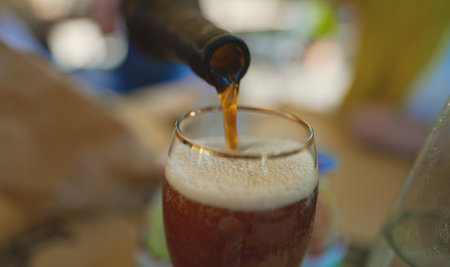 Pouring beer into the glass.の写真素材