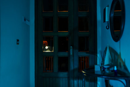 The thief breaks into the house through the front door.の写真素材