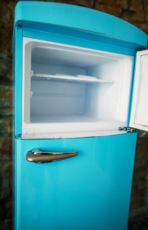 Retro refrigerator freezer with opened door.の写真素材