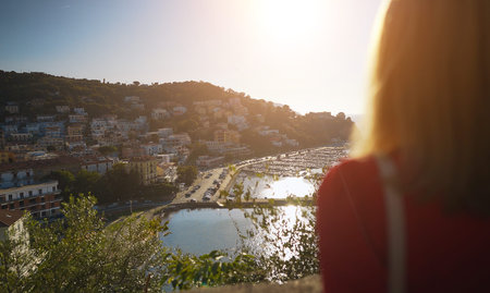 Woman tourist looking at Agropoli town from the hillside.