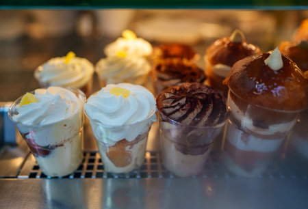Traditional rum baba and whisped cream italian pastries.の写真素材