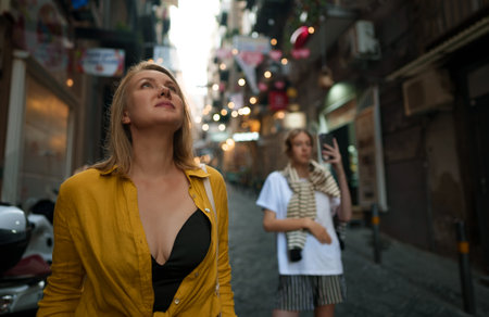 Two female tourists exploring the old town.の写真素材