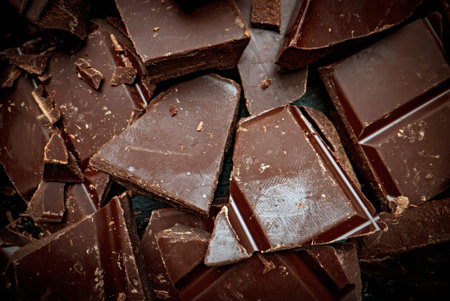 Broken dark chocolate bars. View from above.