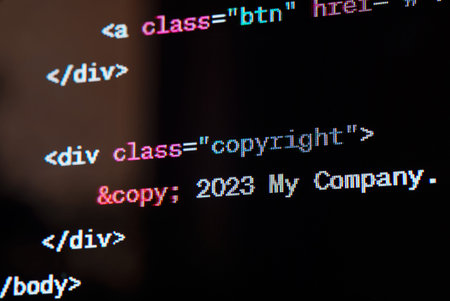 HTML website source code on the screen.