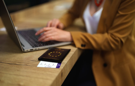Woman with European Union passport is waiting for her flight.の写真素材