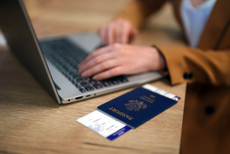 Woman with USA passport is waiting for her flight.の写真素材