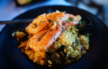 Seafood. Risotto with seafood on a table in a restaurant.の写真素材