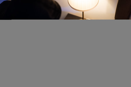 Female thief steals money from the bedside table.の写真素材