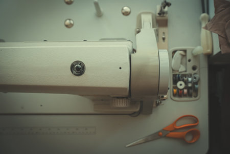 Sewing machine and threads on the table.の写真素材