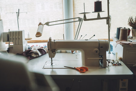 Seamstress's workplace. Sewing machine and various accessories.の写真素材