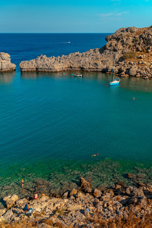 Blue yacht in St. Paul's Bay in Rhodes.