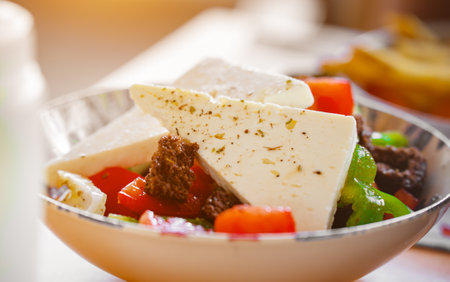 Greek salad with feta cheese, tomatoes and croutons.の写真素材