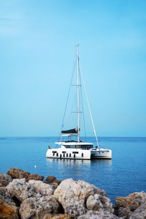 Yacht catamaran sailboat in the blue sea.の写真素材