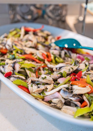 Anchovies in brine with red and green paprika.の写真素材