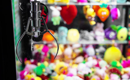 Mechanical claw game machine. Close-up view.の写真素材