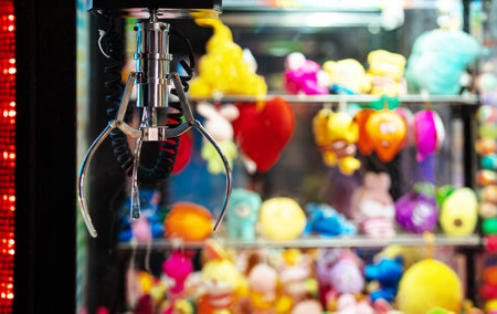 Mechanical claw game machine. Close-up view.の写真素材