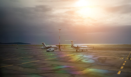 Two private jets are parked at the airport.の写真素材