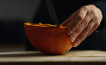 Peeling and cutting the pumpkin.の写真素材