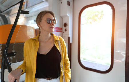 Woman traveling inside the train.の写真素材
