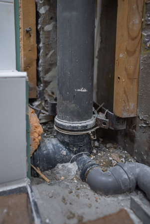 An old-era plumbing stack in an Soviet apartment building.の写真素材