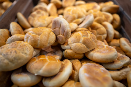 Freshly Baked Bread Rolls Displayed In Bakery.の写真素材