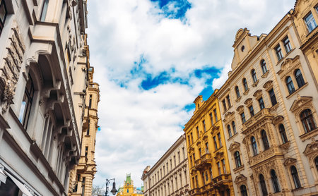 Colorful historic buildings line Prague street.の写真素材