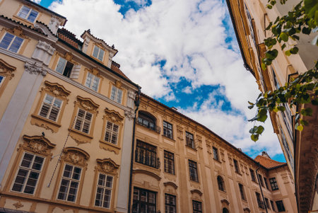 Colorful historic buildings line Prague street.の写真素材