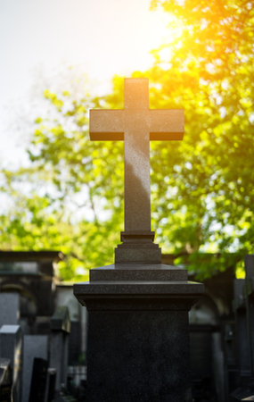 Memorial stone cross in the forest cemetery.の写真素材
