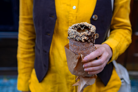 Woman holding traditional Czech chimney cake pastry.の写真素材