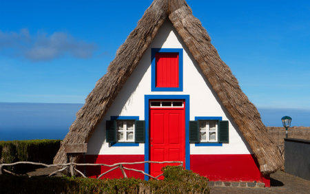 Traditional white and red triangular house in Santana.の写真素材