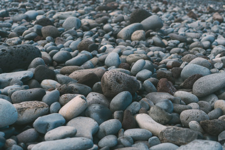 Close up of smooth volcanic river and sea pebbles.の写真素材