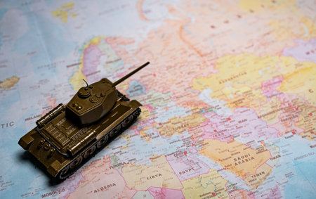 Toy tank model on map of Europe.