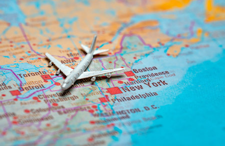 Miniature airplane on map of New York City and East Coast.