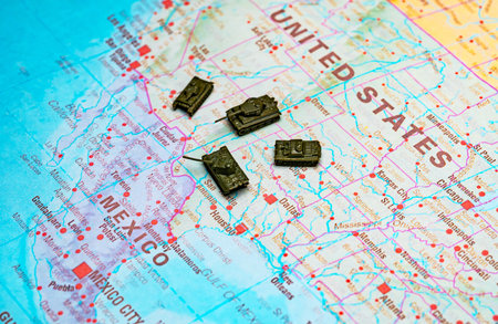 Military patrol and border security on USA Mexico map.