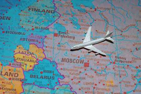 Airplane model on map of Russia flying towards Europe representing reopening of borders.