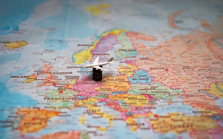 Toy aircraft on barrel atop Europe map.
