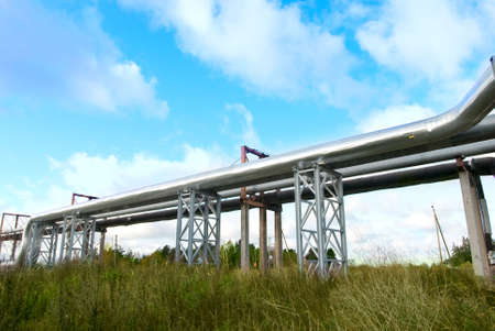 industrial pipelines on pipe-bridge against blue sky.の写真素材