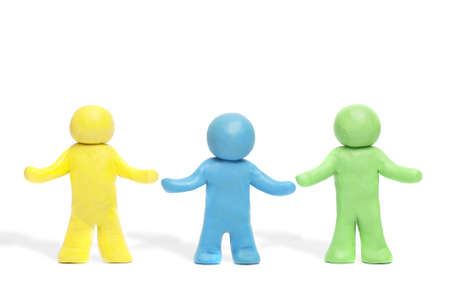 Plasticine human figures on a white backgroundの写真素材