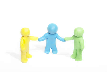 Plasticine human figures on a white backgroundの写真素材