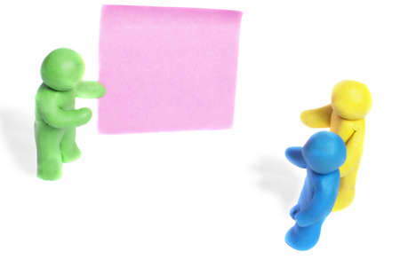 Plasticine human figures on a white backgroundの写真素材