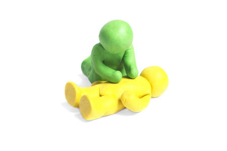 Plasticine human figures on a white backgroundの写真素材