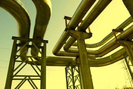 industrial pipelines on pipe-bridge against blue sky.の写真素材