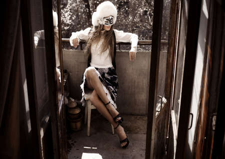 girl on the balcony of the maskの写真素材