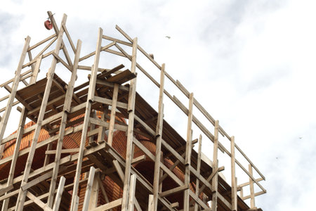 Construction with scaffold pole platforms. Building or reconstruction conceptの写真素材