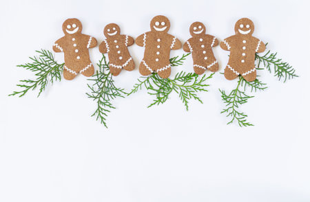 Homemade gingerbread christmas cookies top view on white backgroundの写真素材