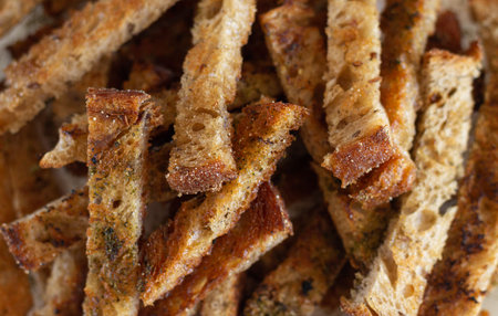 Heap of homemade rye bread croutons with spices
